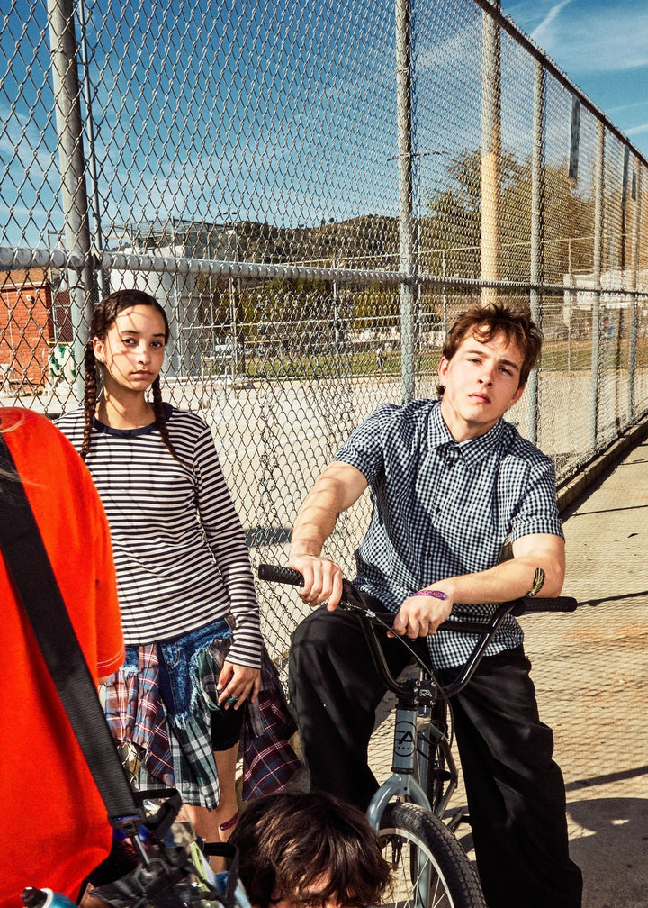 Group of teens with their bikes outdoors on a sunny summer day